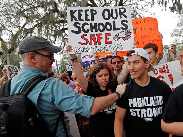 Student survivors from Marjory Stoneman Douglas High School are greeted as they arrive at a rally for gun control reform on the steps of the state capitol, in Tallahassee. (Image: AP) Student survivors from Marjory Stoneman Douglas High School are greeted as they arrive at a rally for gun control reform on the steps of the state capitol, in Tallahassee. (Image: AP)