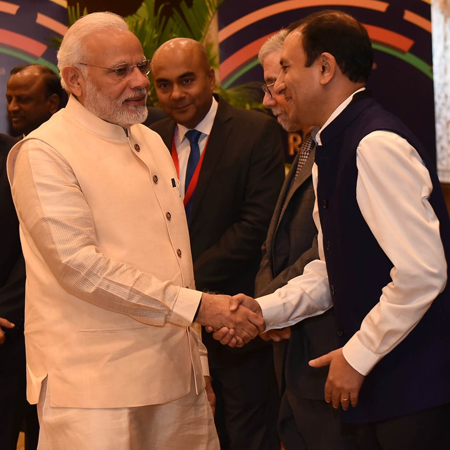 Managing Director, Dalmia Cements, Puneet Dalmia with PM Modi at the News18 Rising India Summit (Photo: News18) Managing Director, Dalmia Cements, Puneet Dalmia with PM Modi at the News18 Rising India Summit (Photo: News18)