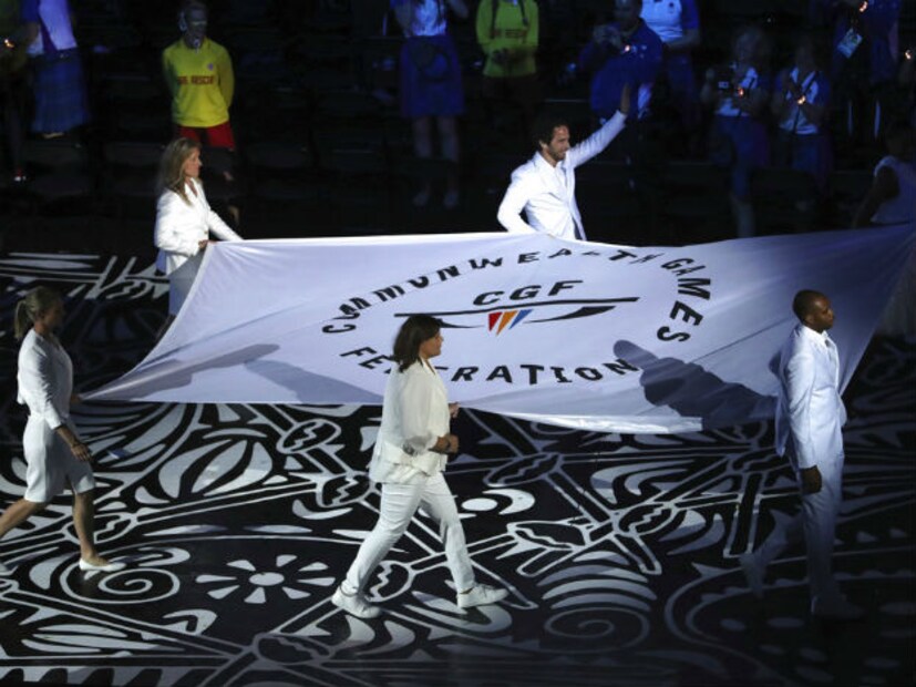 The Commonwealth Games flag is carried into Carrara Stadium for the opening ceremony for the 2018 Commonwealth Games on the Gold Coast, Australia (Photo: AP)