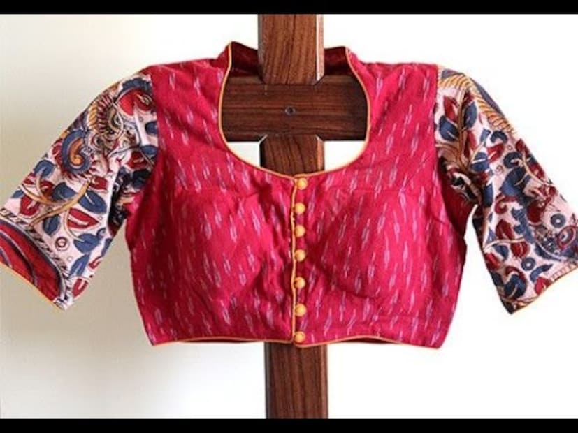 মিক্স অ্যান্ড ম্যাচ সবসময় ফ্যাশনে ইন। ইক্কতের ব্লাউজে কলমকারি স্লিভ। চাইনিজ কলার, সামনে কাপড়ের শো-বোতাম Photo Source : youtube