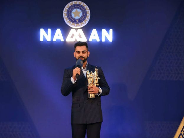 ভারতীয় ক্রিকেট দলের অধিনায়ক বিরাট কোহলিকে ভারতীয় ক্রিকেট কন্ট্রোল বোর্ড (বিসিসিআই)-র বার্ষিক অনুষ্ঠানে পলি উমরিগড় পুরস্কারে সম্মানিত করা হয়েছে। (Photo: PTI) ভারতীয় ক্রিকেট দলের অধিনায়ক বিরাট কোহলিকে ভারতীয় ক্রিকেট কন্ট্রোল বোর্ড (বিসিসিআই)-র বার্ষিক অনুষ্ঠানে পলি উমরিগড় পুরস্কারে সম্মানিত করা হয়েছে। (Photo: PTI)