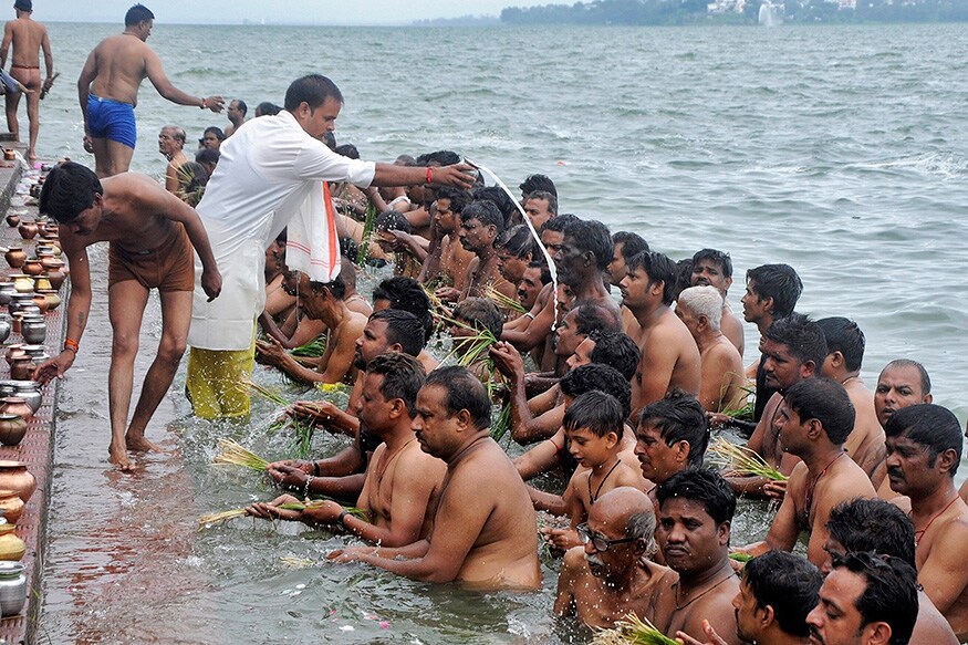 তর্পণ শব্দের ব্যুৎপত্তি হল তৃপ + অনট। তৃপ ধাতুর অর্থ তৃপ্তি সাধন করা। এখানে তৃপ্তি সাধন বলতে দেব-ঋষি- পিতৃ-মনুষ্যগণের তৃপ্তিসাধনকে বোঝানো হয়েছে। সাধারণভাবে মৃত পূর্বপুরুষগণকে জলদান করাকেই তর্পণ বলা হয়। (Photo: Reuters) তর্পণ শব্দের ব্যুৎপত্তি হল তৃপ + অনট। তৃপ ধাতুর অর্থ তৃপ্তি সাধন করা। এখানে তৃপ্তি সাধন বলতে দেব-ঋষি- পিতৃ-মনুষ্যগণের তৃপ্তিসাধনকে বোঝানো হয়েছে। সাধারণভাবে মৃত পূর্বপুরুষগণকে জলদান করাকেই তর্পণ বলা হয়। (Photo: Reuters)