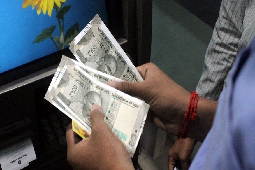 • আজকাল ATM-এর মাধ্যমে অনেক ধরনের কাজ করা যায় ৷ ব্যাঙ্কে গিয়ে লাইনে দাঁড়ানোর সময়ও বেঁচে যায় ৷ আর এই পরিষেবা পাওয়া যায় বিনামূলব্যে ৷ কিন্তু অনেকেই এখনও জানেন না কী কী কাজ ATM-এর মাধ্যমে করা সম্ভব হয় ৷ • আজকাল ATM-এর মাধ্যমে অনেক ধরনের কাজ করা যায় ৷ ব্যাঙ্কে গিয়ে লাইনে দাঁড়ানোর সময়ও বেঁচে যায় ৷ আর এই পরিষেবা পাওয়া যায় বিনামূলব্যে ৷ কিন্তু অনেকেই এখনও জানেন না কী কী কাজ ATM-এর মাধ্যমে করা সম্ভব হয় ৷