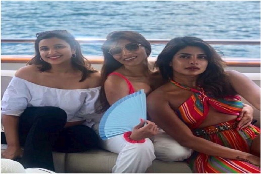 ইয়টে বোন পরিনীতি চোপড়ার সঙ্গে সুপার হট লুক-এ পিগি চপস। সাদা অফ শোল্ডার টপ, নীল ডেনিমে ক্যাজুয়াল পরীনিতি।Photo Source: Instagram ইয়টে বোন পরিনীতি চোপড়ার সঙ্গে সুপার হট লুক-এ পিগি চপস। সাদা অফ শোল্ডার টপ, নীল ডেনিমে ক্যাজুয়াল পরীনিতি।Photo Source: Instagram