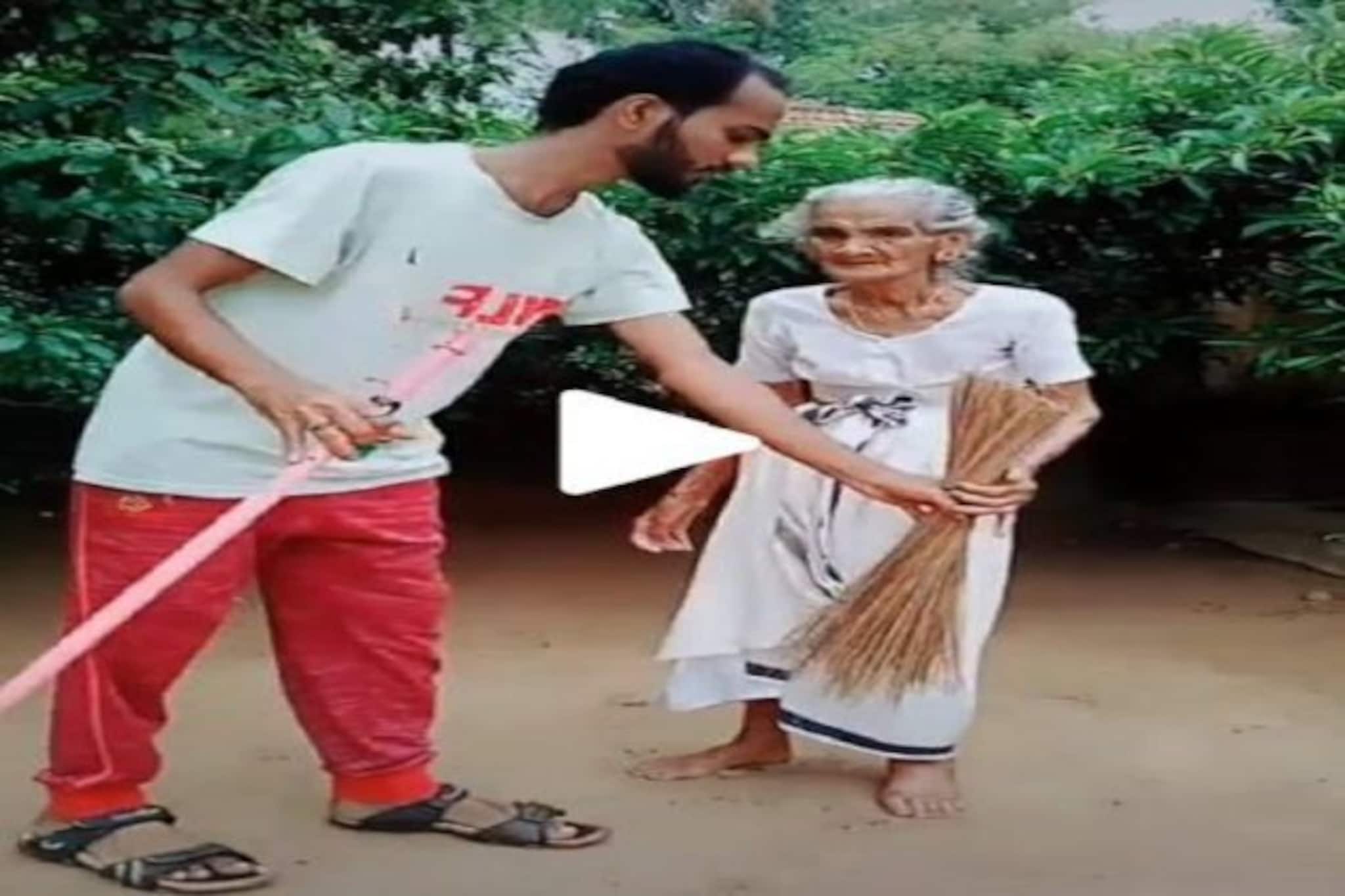 বৃদ্ধার হাত থেকে লাঠি কেড়ে নিয়ে ধরিয়ে দেওয়া হল ঝাঁটা, দেখুন Viral ভিডিও