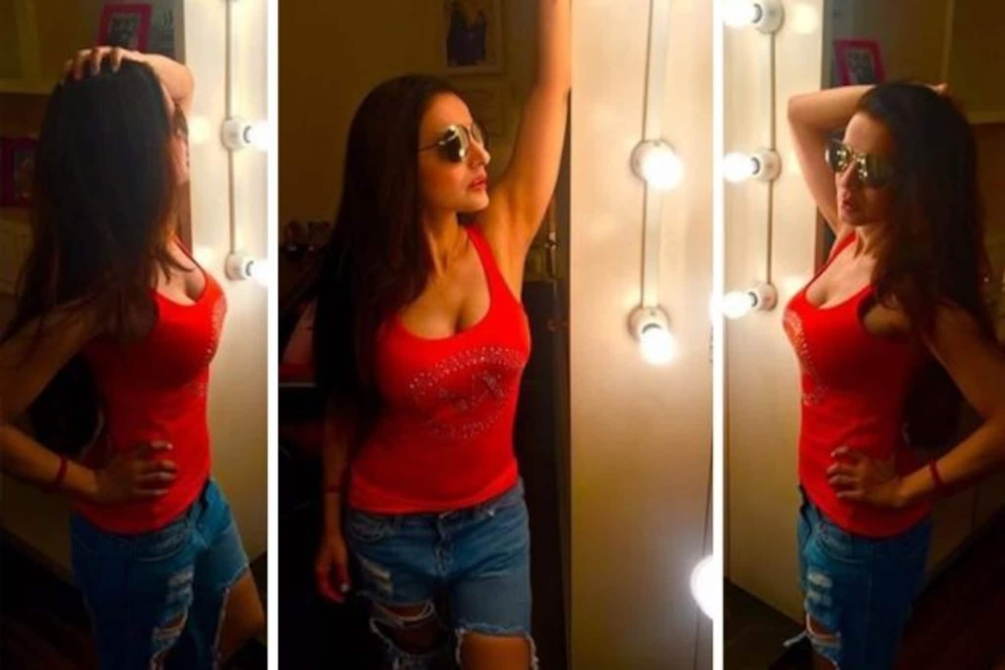 লাল টপ-নীল জিন্স-কালো চশমা,দুর্দান্ত শরীরী ভাষায় সোশ্যাল মিডিয়া কাঁপালেন আমিশা