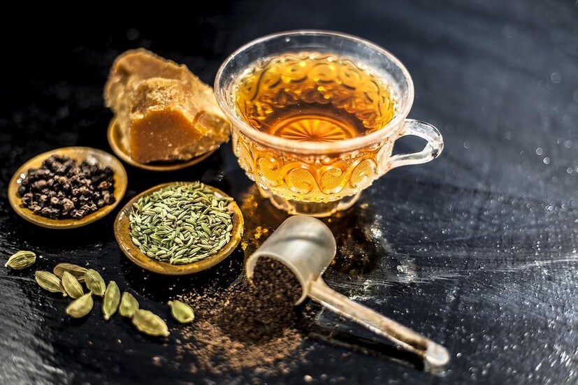 Gud Ki Chai recipe: এক কাপ পরিমাণ জল গরম করুন। জল ফোটার সময় পরিমাণ মতো এলাচ, মৌরি, গোলমরিচ গুঁড়ো, আদা ও চায়ের পাতা দিন। চা ফুটতে শুরু করলে দুধ দিন এবং আবার ফোটাতে শুরু করুন। এ বার চায়ে পরিমাণ মতো গুড় দিন। গুড় দেওয়ার পর, চায়ের মধ্যে যেন তা পুরোপুরি মিশে যায়, সেটা দেখুন। তার পর নামিয়ে নিন। ছেঁকে নিয়ে পরিবেশন করুন। তবে, গুড় দেওয়ার পর বেশিক্ষণ ধরে চা ফোটাবেন না। কারণ এতে চায়ের স্বাদ নষ্ট হয়ে যেতে পারে।  