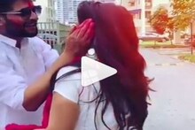 সোহাগ মাখামাখি,স্ত্রী তৃণার মুখ লাল আবিরে রাঙিয়ে দিলেন নীল!দেখুন তৃণা-নীলের দোল