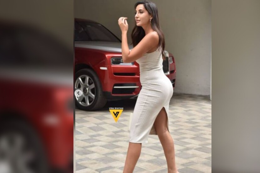 সম্প্রতি এক‌টি বেজ রঙের একটি বডিকন পোশাকে রীতিমতো পারদ চড়ালেন নোরা। সেই পোশাক যেন অভিনেত্রীর গায়ের সঙ্গে মিশে গিয়েছে। 