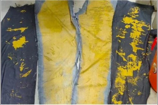 kannur airport official seized 302 grms of gold painted on jeans- Photo Courtesy- ANI/Twitter