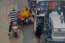 ট্র্যাক্টরের চাকা মাথার উপর দিয়ে চলে গেলেও প্রাণে বেঁচে গেলেন বাইক চালক!