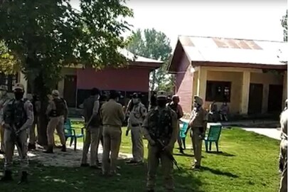 Police at the Srinagar school where militants killed two teachers on Thursday. (News18)