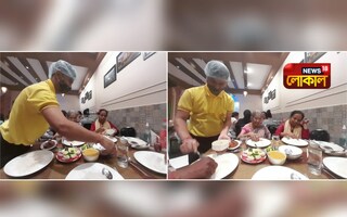 খাবার পরিবেশনে ব্যস্ত এক ওয়েটার