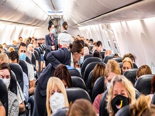 Woman Covid 19 Positive in Plane