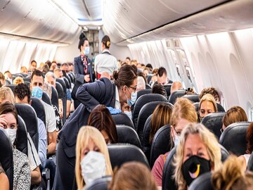 Woman Covid 19 Positive in Plane
