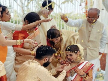 Suraj Nambiar is caught in a cute moment looking at his bride during their Malayali wedding. (Image: Instagram)
