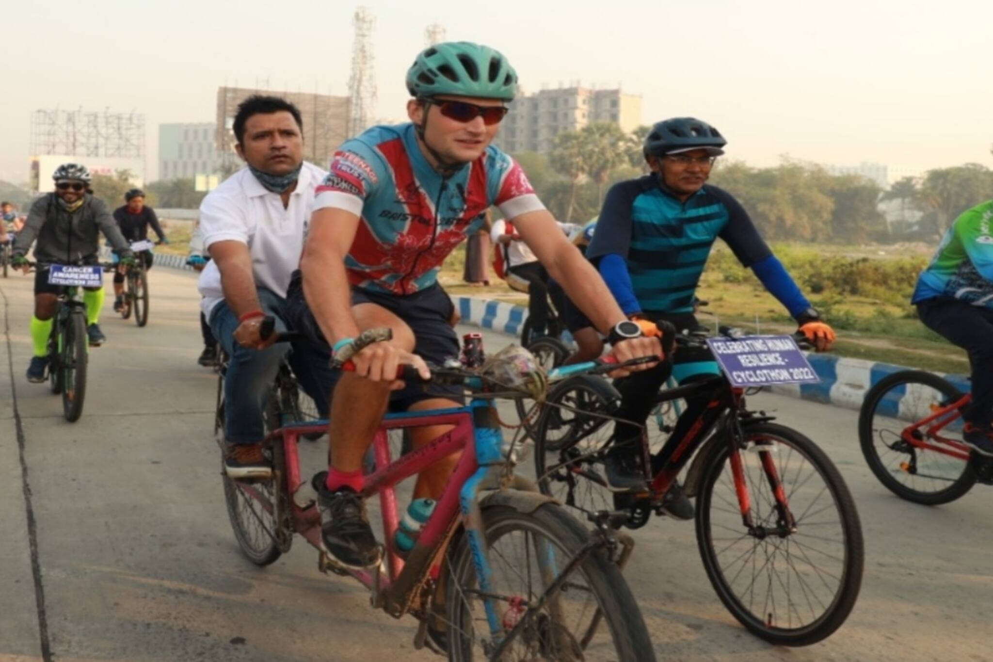 North 24 Parganas News- ক্যান্সার সচেতনতায় ব্রিস্টল টু বেজিং সাইকেল যাত্রা