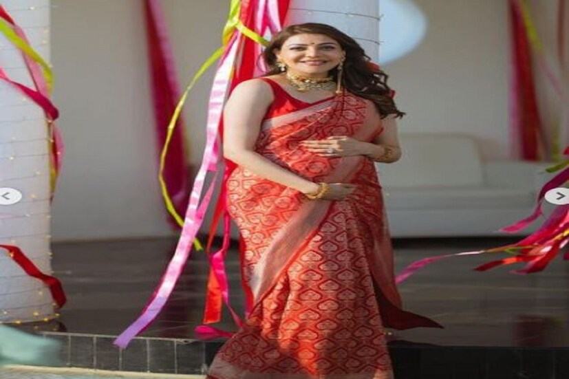 কাজল আগরওয়াল নিজের সাধে (Kajal Aggarwal baby shower ceremony) লাল বেনারসি পরেছেন৷ সিংঘমের হিট নায়িকা দারুণ সুন্দরী৷ শাড়িতে জরির বর্ডার৷  (Photo- Kajal Aggarwal Instagram)