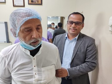 Dr. Abhay Kumar with the patient