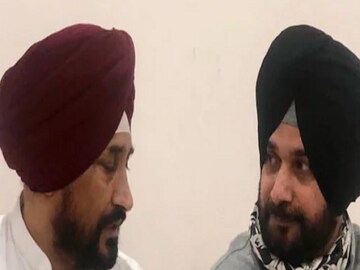 Punjab Congress president Navjot Singh Sidhu (R) with party's CM face Charanjit Singh Channi. (Image: News18/File)
