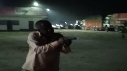 Man shows gun as one person Man shows gun as one person