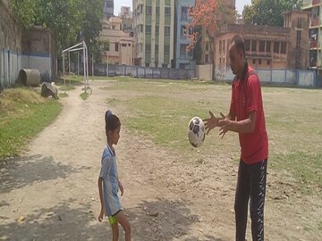 Hoogly News: Buisnessman giving training to his little daughter and son football 