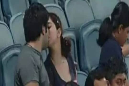 couple spotted kissing during gt vs dc match fans made the picture Viral Photo- Photo Courtesy- Twittter