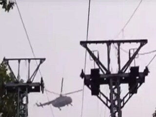 An IAF helicopter has been doing a recce of the accident spot since 5 a.m. on Monday. (Image: Screengrab/News18)