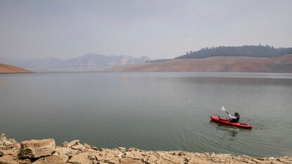 A kayaker fishes in Lake Oroville as water levels remain low due to continuing drought conditions in Oroville, California. (Credits: AP) A kayaker fishes in Lake Oroville as water levels remain low due to continuing drought conditions in Oroville, California. (Credits: AP)
