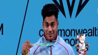 Achinta Sheuli singing national anthem at podium while flag hoisting - Photo Courtesy- Sony Ten 3 / Facebook Video Garb Achinta Sheuli singing national anthem at podium while flag hoisting - Photo Courtesy- Sony Ten 3 / Facebook Video Garb