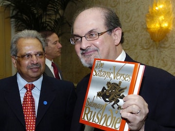 Salman Rushdie with The Satanic Verses