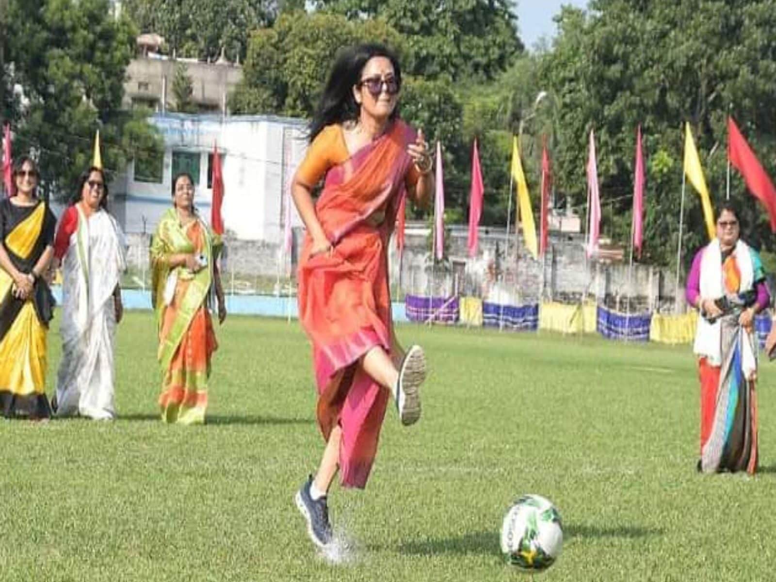 Mahua Moitra plays football in a saree with sports shoes & sunglasses