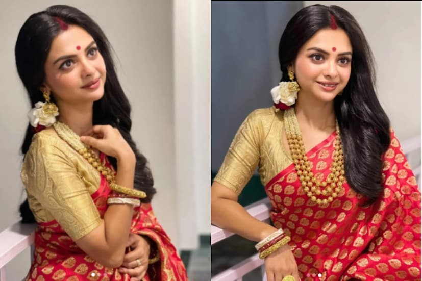 পঞ্চমীতে লালেই ভরসা রেখেছেন শোলাঙ্কি রায়। লাল শাড়ির সঙ্গে সোনালি ব্লাউজ। সোহিনীর মতো তাঁরও মাথায় ফুলের সাজ। পর্দার খড়িও সিঁদুর দিয়ে সেজেছেন।