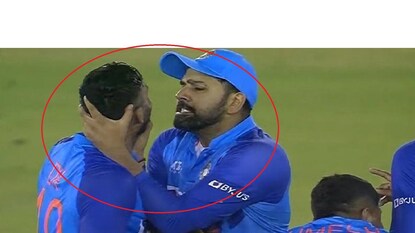 Rohit Sharma jokingly chokes Dinesh Karthik after drs in 1st T20- Photo Courtesy- Twitter Rohit Sharma jokingly chokes Dinesh Karthik after drs in 1st T20- Photo Courtesy- Twitter