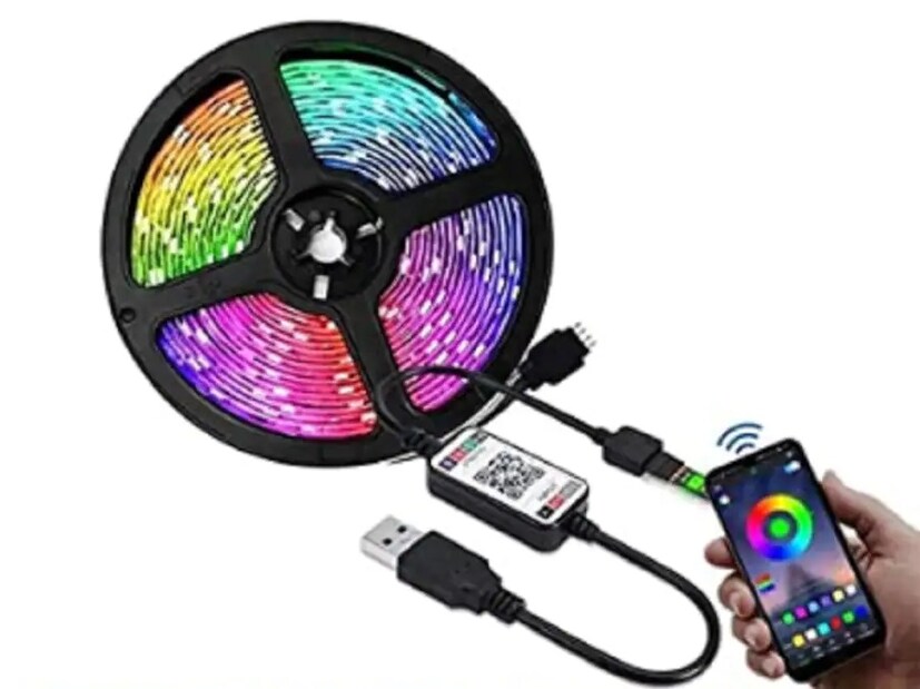 Gesto 300 Smart LED Light Strip - অ্যামাজনের সেলে এই স্মার্ট লাইটের ওপর পাওয়া যাচ্ছে ১ হাজার টাকার ছাড়। এর ফলে অ্যামাজনের এই সেলে এই লাইট পাওয়া যাচ্ছে মাত্র ৯২৫ টাকায়। এই লাইটের আসল দাম ১৯৯৯ টাকা। এই লাইটে রয়েছে ভয়েস কন্ট্রোল সাপোর্ট। ঘরের অন্দরের সাজসজ্জার জন্য এই লাইট ব্যবহার করা হয়। এই লাইটে ব্যবহার করা হয়েছে একটি বিল্ট ইন মাইক। এর সাহায্যে ঘরে চলা মিউজিকের সঙ্গে এই লাইটটিকে সিঙ্ক করানো সম্ভব।