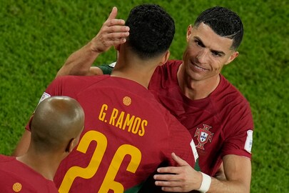Portugal's Cristiano Ronaldo embraces team mate Goncalo Ramos during his substitution at the World Cup group H soccer match between Portugal and Ghana, at the Stadium 974 in Doha, Qatar, Thursday, Nov. 24, 2022. (AP Photo/Francisco Seco)