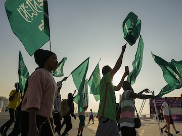 Fans of Saudi Arabia celebrate their team 2-1 victory over Argentina in a World Cup group C soccer match, outside the Lusail Stadium in Lusail Qatar, Tuesday, Nov. 22, 2022. (AP Photo/Andre Penner)