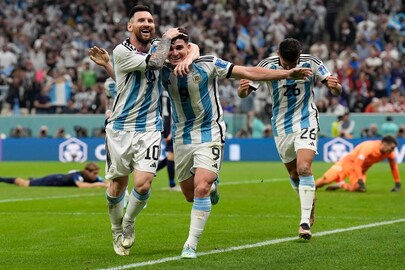 Argentina's Lionel Messi, left, and Argentina's Julian Alvarez celebrate after scoring during the World Cup semifinal soccer match between Argentina and Croatia at the Lusail Stadium in Lusail, Qatar, Tuesday, (AP Photo/Martin Meissner)