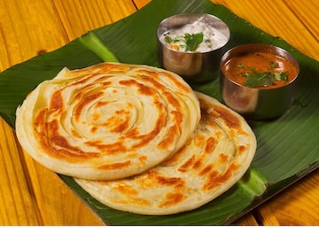 সামান্য রান্নার কৌশলে বাজিমাত করবে দক্ষিণ ভারতীয় পরোটা আর আলু কোর্মা, বানিয়ে চমকে দিন সবাইকে (IStock)