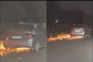 এ ভাবেই গাড়ির নীচ থেকে ছিটকে বেরোল আগুন। 