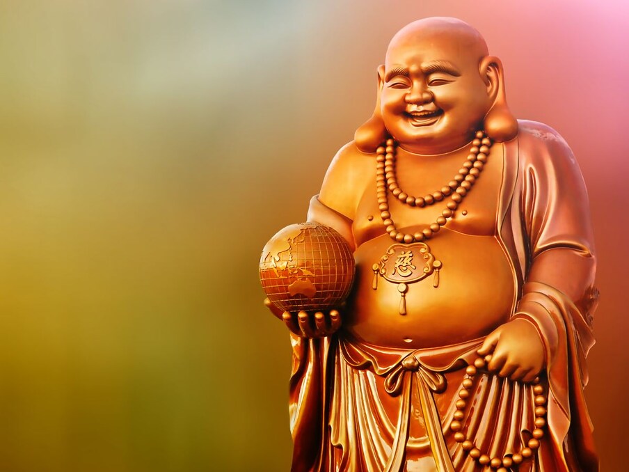  নয়া দিল্লি: বাড়িতে লাফিং বুদ্ধ খুবই গুরুত্বপূর্ণ বলে মনে করা হয়। এটা বিশ্বাস করা হয়, যে যদি লাফিং বুদ্ধকে বাড়িতে আনা হয় তাহলে সুখ, সমৃদ্ধির জন্য অনেক উপকারি হতে পারে।ছবি: Canva