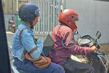 দীর্ঘ যানজটের মধ্যেই Rapido Bike-এ বসে ল্যাপটপে কাজে মগ্ন তরুণী, ভাইরাল ছবি