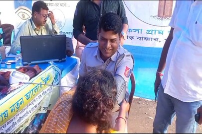 দুয়ারে সরকার শিবিরে স্বাস্থ্য পরীক্ষা করালেন পুলিশ আধিকারিক, চোখ দেখালেন উপপ্রধান!