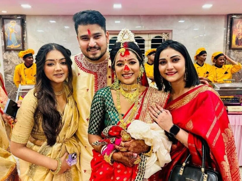 অগ্রহায়ণের সন্ধ্যায় স্বর্ণদীপ্ত-অর্পিতা সাতপাকে বাঁধা পড়ল। বাঙালি সাজে সেজে উঠেছিলেন তারকা দম্পতি। পঞ্জাবি-ধুতি সঙ্গে মাথায় টোপর পড়ে বরের সাজে স্বর্ণদীপ্ত। অন্যদিকে, লাল টুকটুকে বেনারসী, সঙ্গে মানানসই গয়নায় রাঙা বউ অর্পিতা।