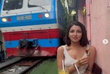 কাফেতে বসা তরুণীর প্রায় গায়ের উপর দিয়ে হুড়মুড়িয়ে চলে গেল ট্রেন ! দেখুন ভিডিও