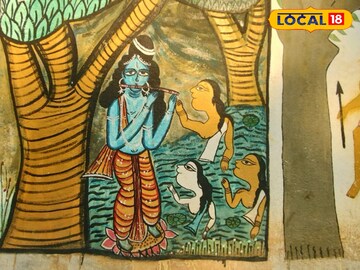 বাড়ির দেওয়ালে আঁকা ভেষজ পট চিত্র
