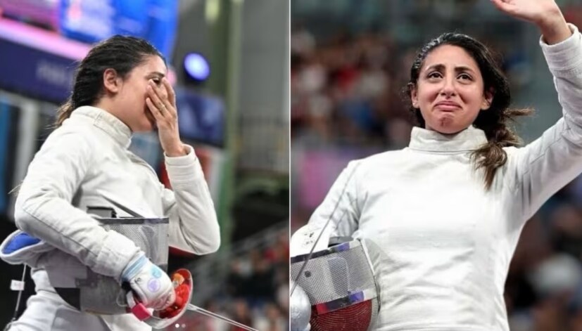 ৭ মাসের অন্তঃসত্ত্বা। তারপরেও অংশ নিয়েছেন অলিম্পিক্সে। এমনই নজিরবিহীন ঘটনার সাক্ষী থাকল গোটা বিশ্ব। মহিলাদের ফেন্সিংয়ের প্রথম ম্যাচে বিশ্বের ১০ নম্বর এলিজাবেথ টারটাভোস্কিকে (Elizabeth Tartakovsky) পরাজিত করেন মিশরীয় নাদা হাফেজ (Nada Hafez)। তবে দক্ষিণ কোরিয়ার জিওন হাউংয়ের (Jeon Hayoung) কাছে হেরে যান। তারপরই একটি সোশ্যাল মিডিয়া পোস্টে নিজের গর্ভাবস্থার খবর জানান নাদা। Photo: Instagram/nada_hafez ৭ মাসের অন্তঃসত্ত্বা। তারপরেও অংশ নিয়েছেন অলিম্পিক্সে। এমনই নজিরবিহীন ঘটনার সাক্ষী থাকল গোটা বিশ্ব। মহিলাদের ফেন্সিংয়ের প্রথম ম্যাচে বিশ্বের ১০ নম্বর এলিজাবেথ টারটাভোস্কিকে (Elizabeth Tartakovsky) পরাজিত করেন মিশরীয় নাদা হাফেজ (Nada Hafez)। তবে দক্ষিণ কোরিয়ার জিওন হাউংয়ের (Jeon Hayoung) কাছে হেরে যান। তারপরই একটি সোশ্যাল মিডিয়া পোস্টে নিজের গর্ভাবস্থার খবর জানান নাদা। Photo: Instagram/nada_hafez