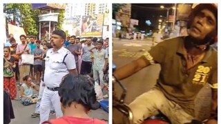 পুলিশ অফিসারকে ঘেরাও করে রেখেছেন বিক্ষোভকারীরা৷ অভিযুক্ত সিভিক ভলেন্টিয়ার (ডানদিকে)৷ পুলিশ অফিসারকে ঘেরাও করে রেখেছেন বিক্ষোভকারীরা৷ অভিযুক্ত সিভিক ভলেন্টিয়ার (ডানদিকে)৷