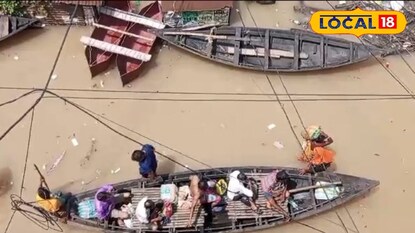 নৌকায় চাপিয়ে আনা হল মহিলাকে