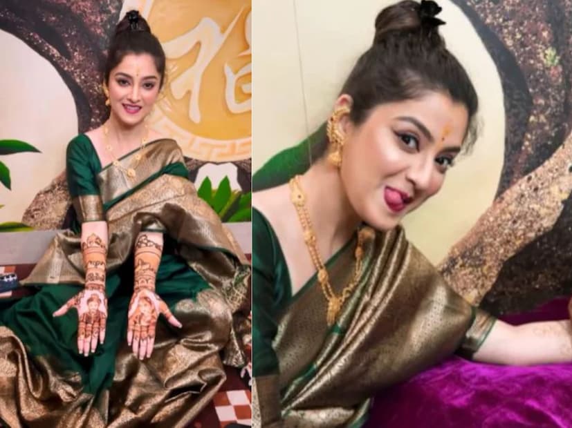 সবুজ সিল্কের শাড়ি পরেছিলেন তিনি৷ দু’হাত ভরে পরেছেন মেহন্দি৷ তাতে আবার রয়েছে তাদের দু’জনের মুখ৷